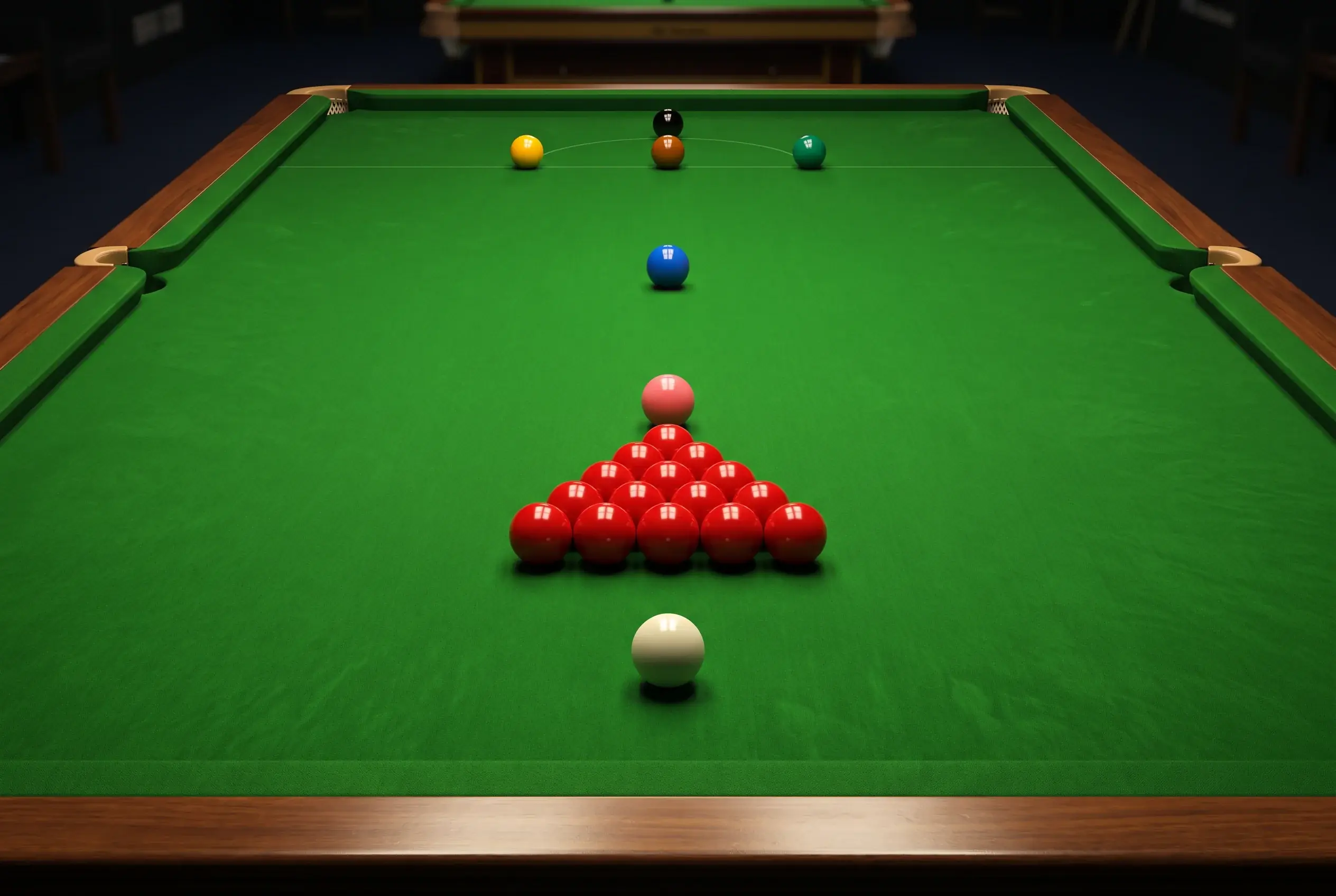 Rote und farbige Snookerkugeln auf dem grünen Tuch in der typischen Startformation eines Frames vor dem Break-off